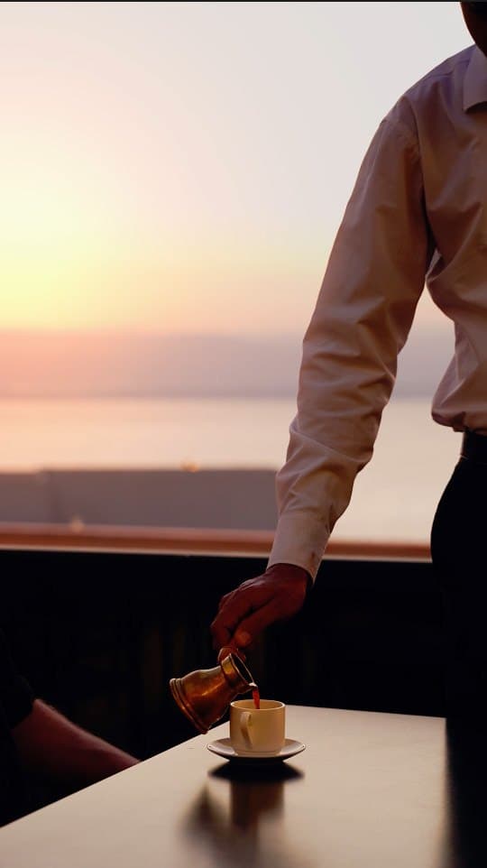 Coffee served at sunset overlooking the view from Cattleya